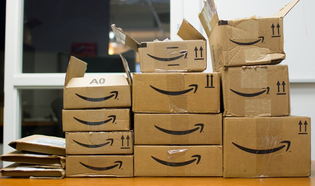 A stack of amazon boxes on a table